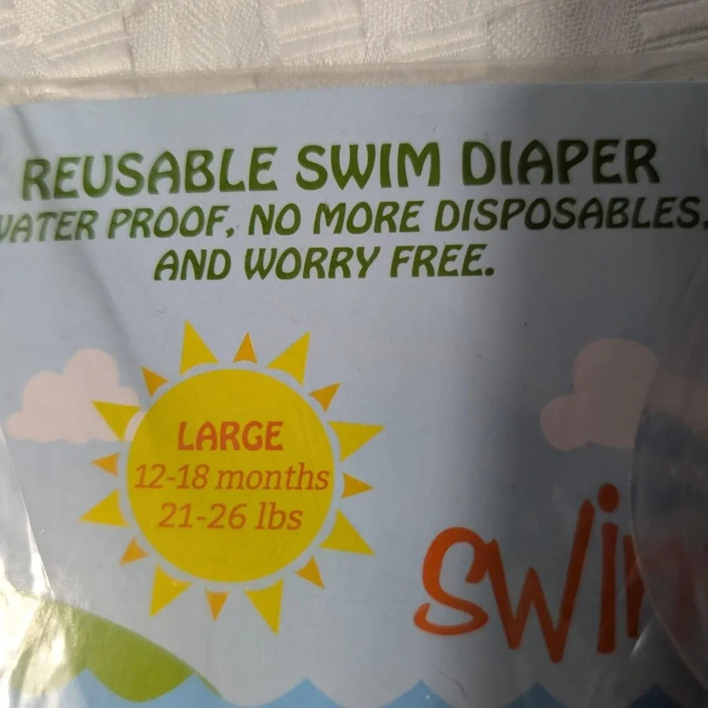 Swimtime reusable swim diaper with pink and light blue mermaid scale pattern